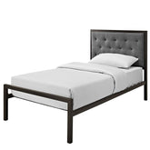 A modern bed showcasing a gray headboard paired with a black frame, ideal for a chic bedroom setting.